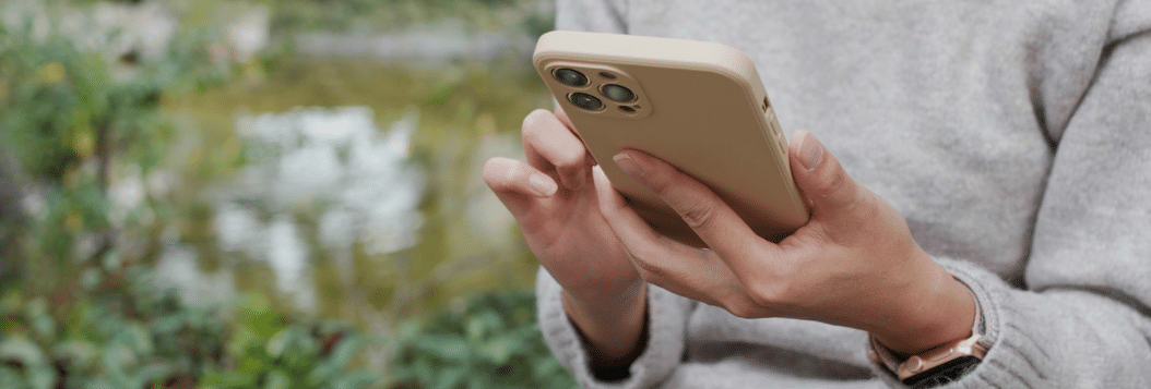 Close up of a woman's hands holding her phone