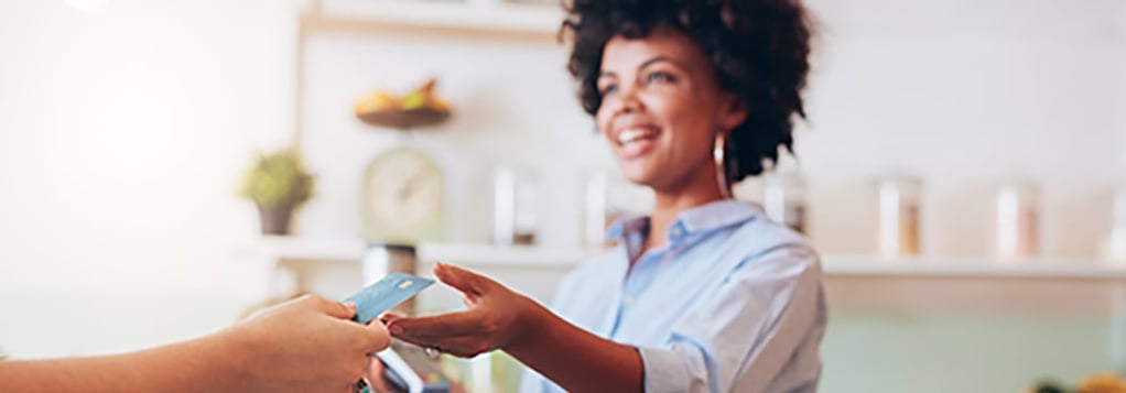 black business owner accepting card payment from customer