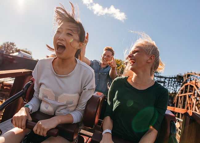 two teenage girls on roller coaster