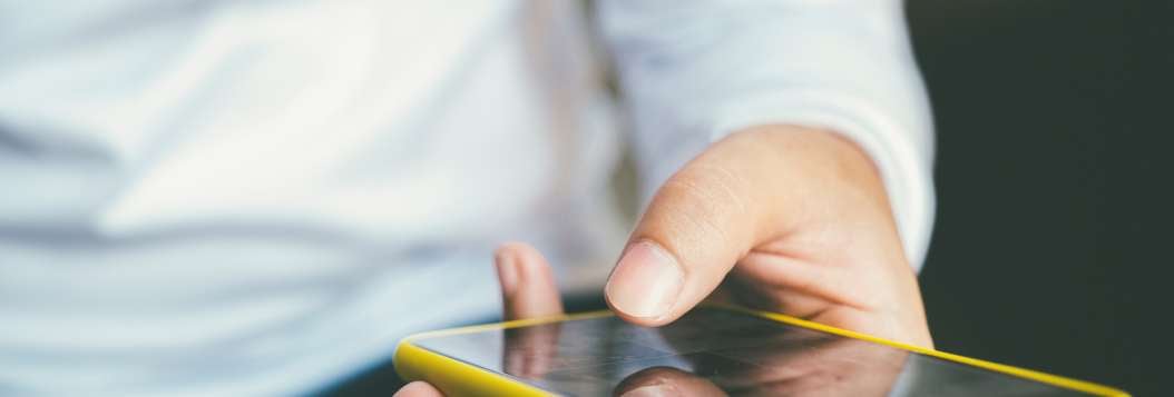 man making payment on mobile phone