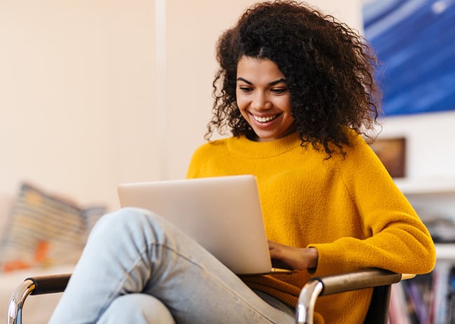 young woman viewing content on laptop