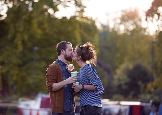 Couple kissing on a boat on a canal