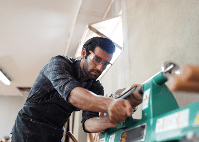 Carpenter work with equipment in shop