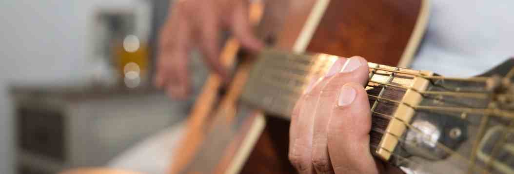 retired man playing guitar (1)