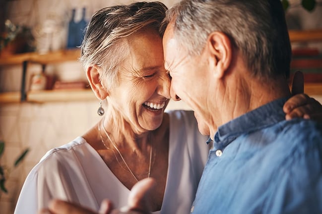 happy dancing retired couple