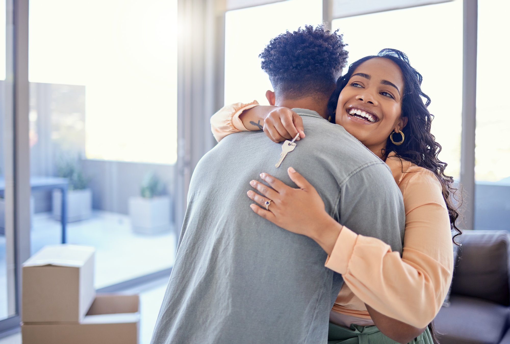happy-couple-celebrating-new-home-with-keys-2026-01-09-10-41-07-utc