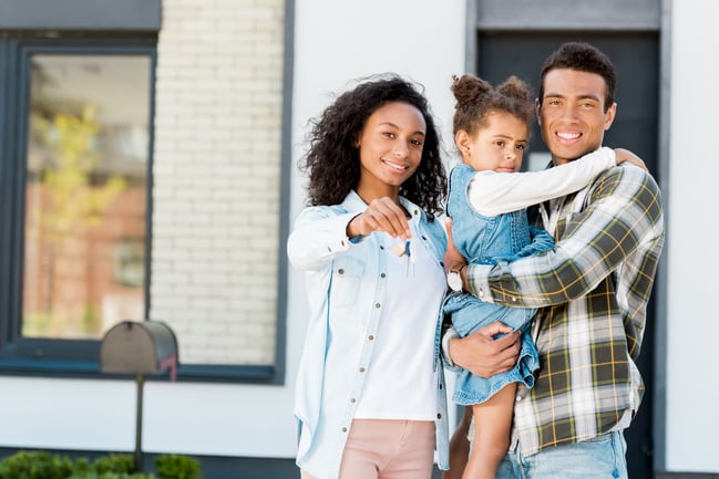happy-family-outside-new-home-holding-keys-2026-01-06-00-33-51-utc