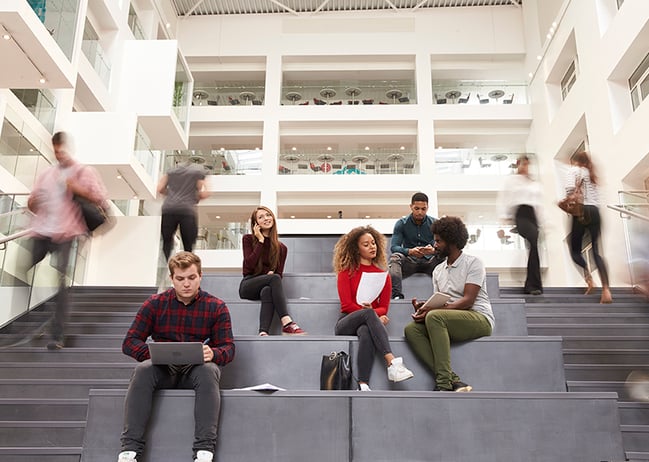college students in busy campus building