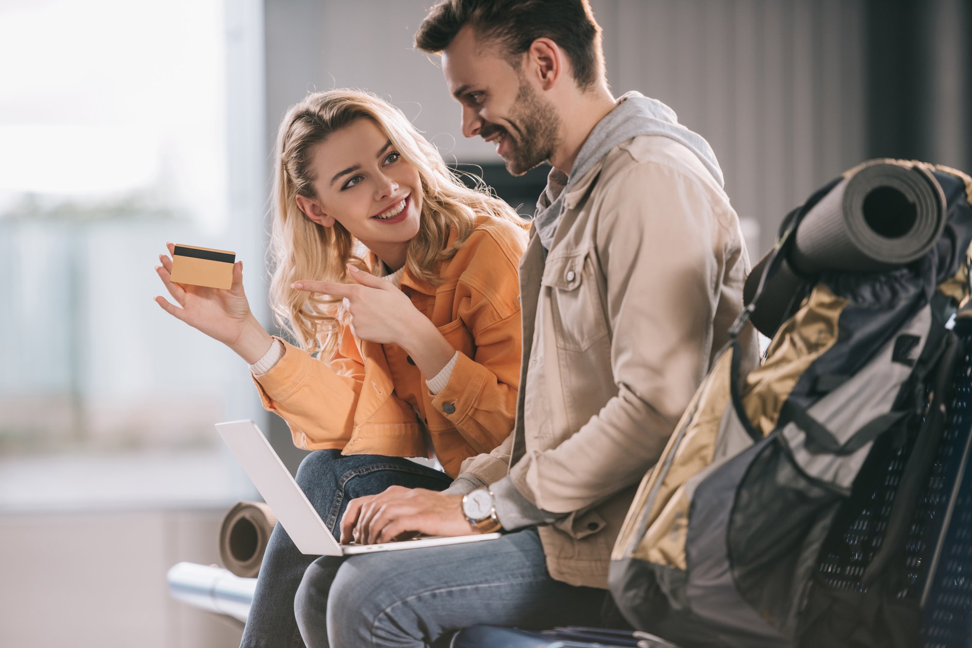 smiling-girl-pointing-with-finger-at-credit-card-a-2026-01-06-00-30-54-utc