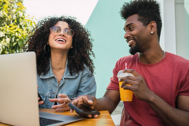 two-afro-friends-using-laptop-at-a-cafeteria-2026-03-25-22-34-06-utc