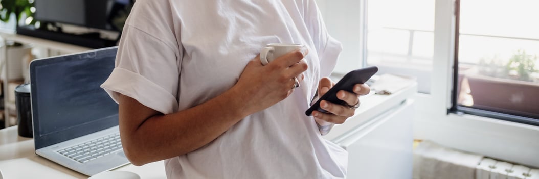 young-adult-focused-on-their-smartphone-in-a-brigh-2025-04-05-03-12-57-utc