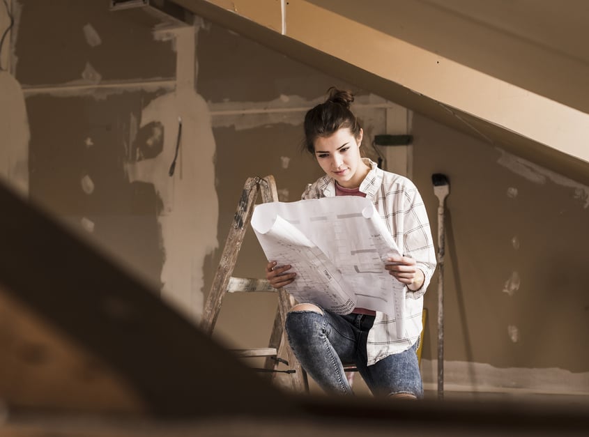 young-woman-renovating-her-new-home-holding-const-2024-09-18-07-08-12-utc-1