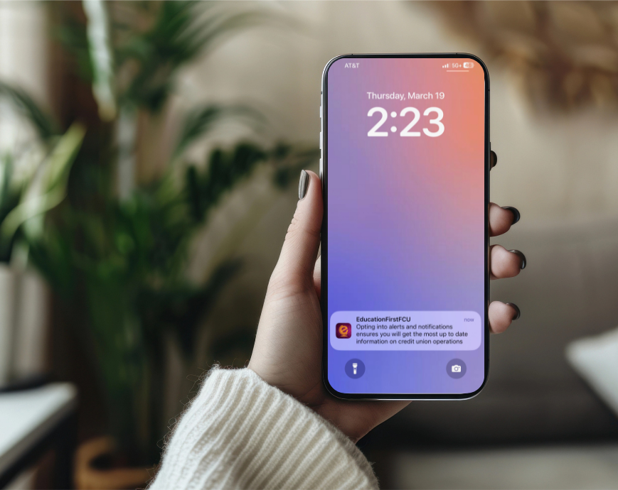 woman holding mobile phone displaying notification