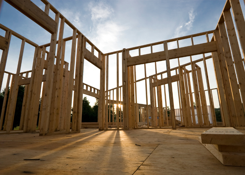 Interior view of a new construction home that only has framing complete. 