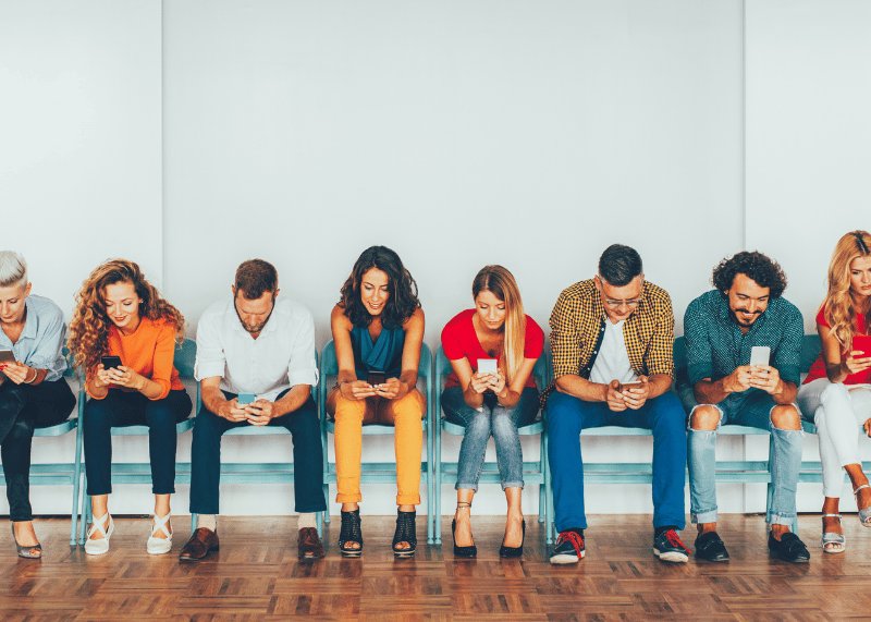 group of people reading news on their mobile phones