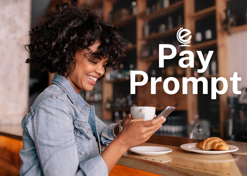 Woman sitting in coffee shop looking at phone