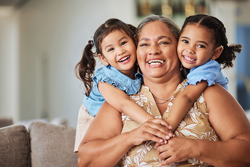 relaxed smiling grandmother with grandchildren