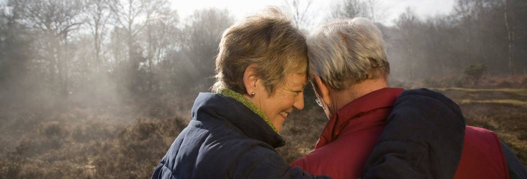 retired couple with enjoying a walk