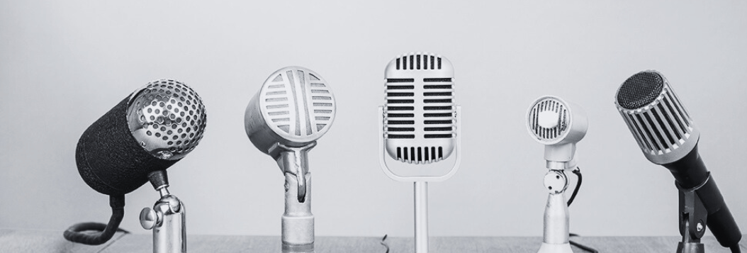 Group of retro microphones on tabletop